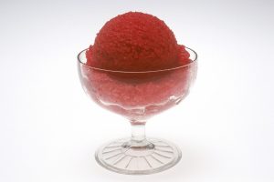 raspberry sherbet in a glass bowl