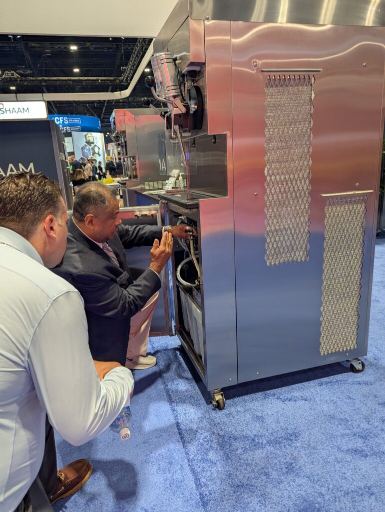 An Electro Freeze team member demonstrates the ease of cleaning the GES-2080