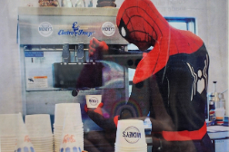 Spiderman dispensing soft serve from an Electro Freeze machine